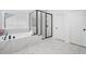 Bathroom with a soaking tub, a glass shower, and sleek, modern fixtures at 1225 Westshore Dr, Cumming, GA 30041
