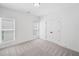 Bedroom featuring carpet, neutral walls, a window with blinds, and a closet at 1225 Westshore Dr, Cumming, GA 30041