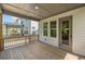 Spacious covered deck perfect for entertaining, offering views of the yard and community at 1225 Westshore Dr, Cumming, GA 30041