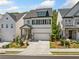 Attractive two-story home with a neutral color scheme, tidy landscaping, and a welcoming front porch in a suburban setting at 1225 Westshore Dr, Cumming, GA 30041