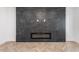 Living room with black marble fireplace and herringbone floors at 1225 Westshore Dr, Cumming, GA 30041
