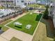 Aerial view of cornhole game area in the community with synthetic grass at 1225 Westshore Dr, Cumming, GA 30041