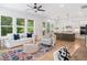 Bright, open living space with a view into the kitchen, featuring hardwood floors and contemporary furnishings at 1225 Westshore Dr, Cumming, GA 30041