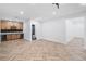 Open-concept living room featuring a bar area, modern lighting, and herringbone floors at 1225 Westshore Dr, Cumming, GA 30041