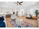 Expansive open-concept living space with a modern kitchen, hardwood floors, and comfortable seating arrangements at 1225 Westshore Dr, Cumming, GA 30041