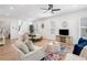 Spacious and inviting living area showcasing hardwood floors, a dining area, and a view of the staircase at 1225 Westshore Dr, Cumming, GA 30041