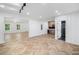 Open-concept living room featuring new herringbone floors, bar area, and modern lighting at 1225 Westshore Dr, Cumming, GA 30041