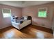 Bare bedroom features hardwood floors and windows for natural light at 1810 Trophy Dr, Marietta, GA 30062