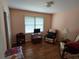 Bedroom with hardwood floors, large windows, and cozy seating arrangements at 1810 Trophy Dr, Marietta, GA 30062