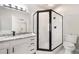 Bathroom features a glass enclosed shower, marble countertop and black fixtures at 2055 Deans Landing Dr, Lawrenceville, GA 30043