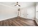 Large bedroom features hardwood flooring, and neutral paint at 2055 Deans Landing Dr, Lawrenceville, GA 30043