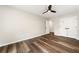 Bedroom with wood floors, ceiling fan, double closet, and a light gray color palette at 2055 Deans Landing Dr, Lawrenceville, GA 30043