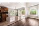 Light-filled dining area with wood floors, breakfast bar, backyard access and lots of windows at 2055 Deans Landing Dr, Lawrenceville, GA 30043