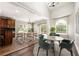 Dining area with backyard access and a view of kitchen, offering a comfortable space for meals and entertaining at 2055 Deans Landing Dr, Lawrenceville, GA 30043