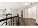 Upstairs hallway with hardwood floors and staircase at 2055 Deans Landing Dr, Lawrenceville, GA 30043
