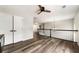 Hallway area with hardwood flooring, a ceiling fan, and access to closets and other rooms at 2055 Deans Landing Dr, Lawrenceville, GA 30043