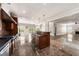 Open kitchen featuring stainless steel appliances and a center island with bar seating, seamlessly connecting to the living area at 2055 Deans Landing Dr, Lawrenceville, GA 30043