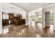 Open kitchen featuring stainless steel appliances, dark wood cabinets, and breakfast bar, connecting to living space at 2055 Deans Landing Dr, Lawrenceville, GA 30043
