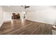 Expansive open-plan living room featuring hardwood floors and seamless flow into the adjacent kitchen and dining areas at 2055 Deans Landing Dr, Lawrenceville, GA 30043