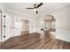Living room features hardwood floors, white trim, and arched doorway at 2055 Deans Landing Dr, Lawrenceville, GA 30043
