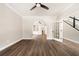 Hardwood floors add beauty to the living room, which leads to the staircase and other rooms at 2055 Deans Landing Dr, Lawrenceville, GA 30043