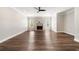 Inviting living room showcasing a cozy fireplace, complemented by hardwood flooring and natural light from the windows at 2055 Deans Landing Dr, Lawrenceville, GA 30043