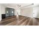 Spacious living room featuring wood floors, stylish built-ins, and a modern ceiling fan at 2055 Deans Landing Dr, Lawrenceville, GA 30043