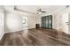 Primary bedroom with hardwood floors, ceiling fan, recessed lighting, and two closets, providing ample storage at 2055 Deans Landing Dr, Lawrenceville, GA 30043