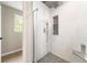 Modern shower with glass doors, a tiled ceiling, and a built-in seat at 2055 Deans Landing Dr, Lawrenceville, GA 30043