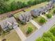 Aerial view of neighborhood homes showcasing well-manicured lawns and landscaping at 2435 Sentinel Chase Way, Cumming, GA 30041