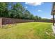A spacious backyard with green grass and a play structure at 2435 Sentinel Chase Way, Cumming, GA 30041