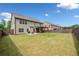 Large backyard with covered patio, perfect for outdoor entertaining and relaxation at 2435 Sentinel Chase Way, Cumming, GA 30041