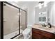 Bathroom with a glass shower, toilet, and vanity at 2435 Sentinel Chase Way, Cumming, GA 30041