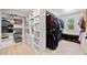 Large walk-in closet with custom shelving and hanging racks at 2435 Sentinel Chase Way, Cumming, GA 30041