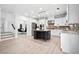 Bright kitchen featuring white cabinets, stainless appliances, center island, and light hardwood floors at 2435 Sentinel Chase Way, Cumming, GA 30041