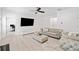 Neutral living room with hardwood floors, grey couch, and white trim at 2435 Sentinel Chase Way, Cumming, GA 30041