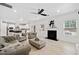 This living room has recessed lighting, fireplace, hardwood floors, and plush couches at 2435 Sentinel Chase Way, Cumming, GA 30041