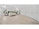 A expansive main bedroom with hardwood floors, tray ceilings, and large windows at 2435 Sentinel Chase Way, Cumming, GA 30041