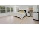 Spacious main bedroom with hardwood floors, tray ceilings, and large windows at 2435 Sentinel Chase Way, Cumming, GA 30041