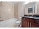 Bathroom with a tub/shower combo, granite counters, and tile flooring at 2801 Avington Se Ln, Smyrna, GA 30080