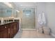 Modern bathroom with a glass-enclosed shower and dark wood vanity at 2801 Avington Se Ln, Smyrna, GA 30080