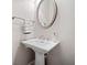 Elegant pedestal sink in a well-lit bathroom at 2801 Avington Se Ln, Smyrna, GA 30080