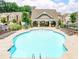 Community pool with lounge chairs and pavilion for relaxing on sunny days at 2801 Avington Se Ln, Smyrna, GA 30080