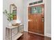 Warm entryway with a wood front door, elegant marble-top console table, and stylish decor at 2801 Avington Se Ln, Smyrna, GA 30080