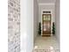 Inviting entryway features a wood door with sidelights, topiaries, and brick accents at 2801 Avington Se Ln, Smyrna, GA 30080