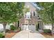 Charming brick home featuring an attached garage, landscaped front yard, and a small balcony at 2801 Avington Se Ln, Smyrna, GA 30080