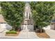 Beautiful townhome with a three-car garage, brick facade, and lush landscaping at 2801 Avington Se Ln, Smyrna, GA 30080