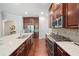 Modern kitchen features stainless steel appliances, mosaic backsplash, and a large island with quartz counters at 2801 Avington Se Ln, Smyrna, GA 30080