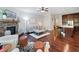 Open concept living area with a stone fireplace, hardwood floors, and seamless flow to the kitchen at 2801 Avington Se Ln, Smyrna, GA 30080