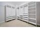 A walk-in closet featuring custom shelving, drawers, and ample storage space at 2801 Avington Se Ln, Smyrna, GA 30080